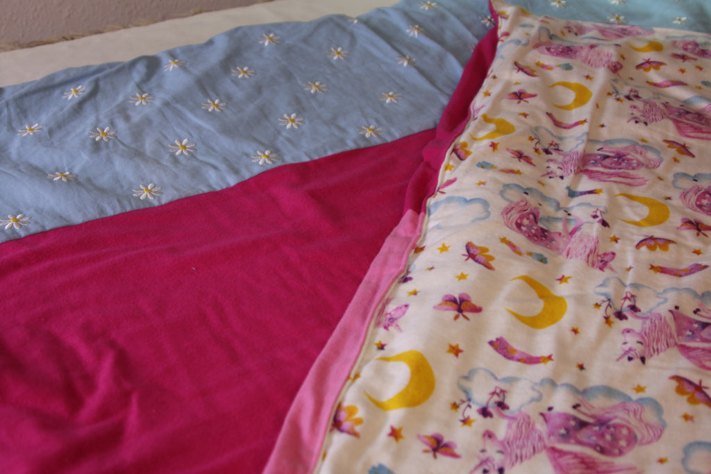 Pink and white unicorn pattern blanket