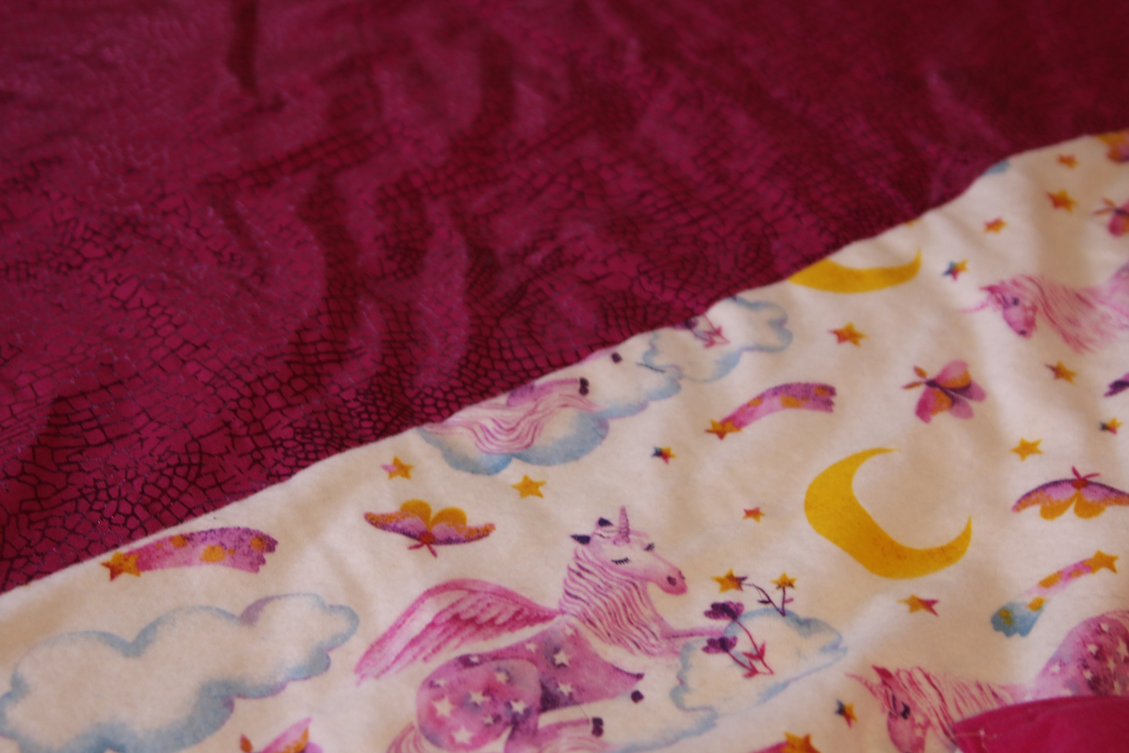 Pink and white unicorn pattern blanket