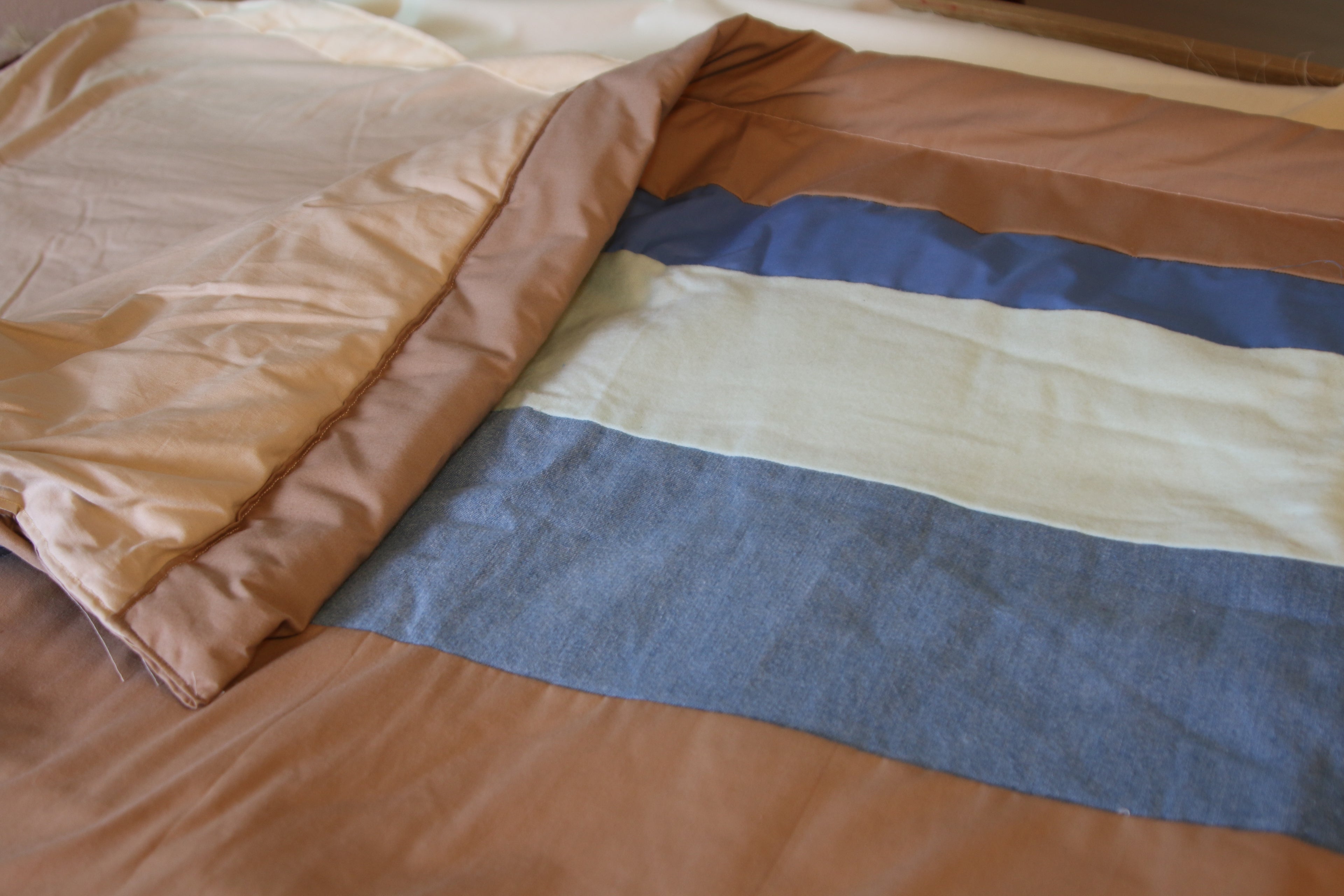 Denim and camel colored blanket