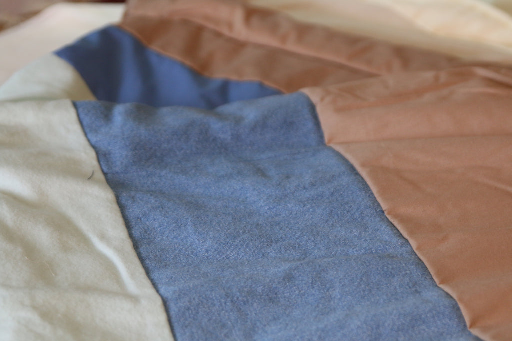 Denim and camel colored blanket